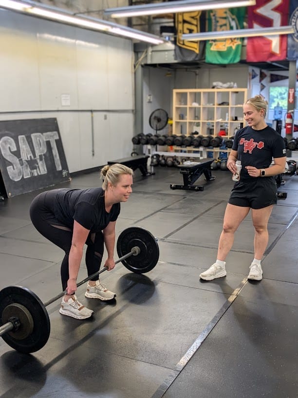NOVA Strong Client Deadlifting as part of her Barbell Training